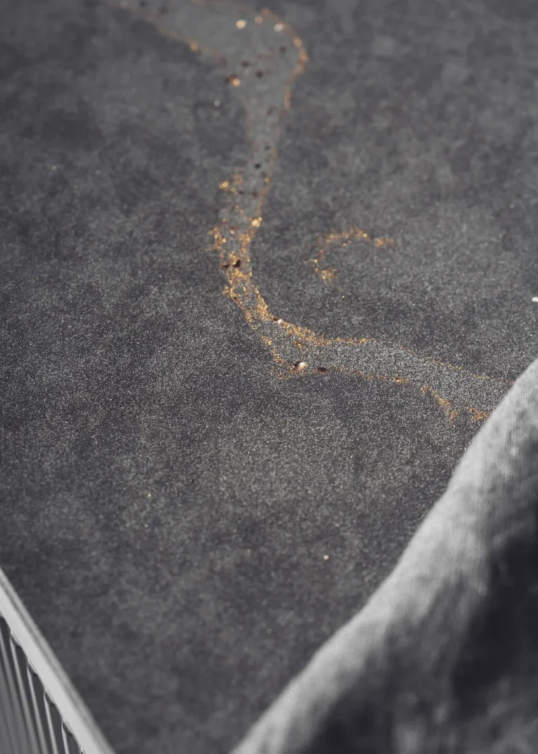 Stylish modern kitchen featuring black fluted fronts and warm oak-lit niches, creating a cozy yet sophisticated ambiance. Part of the Arta Kitchen Collection by MY-SPACE.