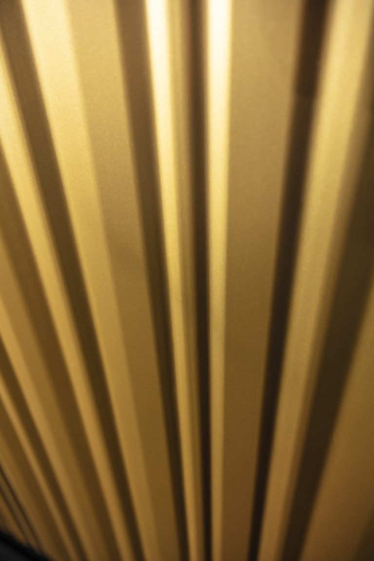 Modern kitchen with luxurious gold wavy fronts from the Ariana Kitchen Collection by MY-SPACE, perfect for a glamorous interior.